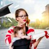 Young woman with baby in carrier with university campus in background and mortar board