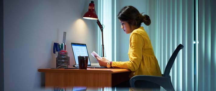 girl at desk using computer