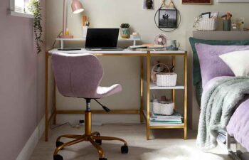 student bedroom with desk and chair next to bed