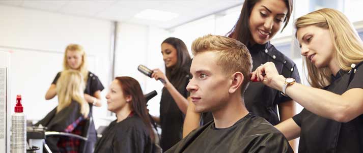 hair stylists working on clients' hair at a hairdressers