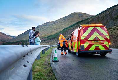 rac van on side of the road with family watching on